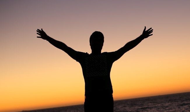 man water arms raised sunset_pexels-photo-356642_Cropped