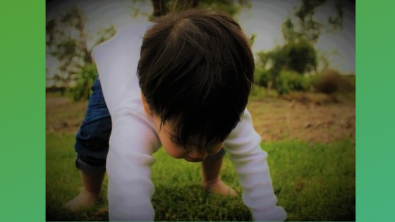 child bent over to ground
